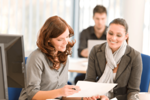 Professional and client reviewing document