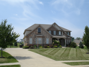 Exterior of a large home with faux stone siding